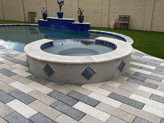 Pool spa with paver deck