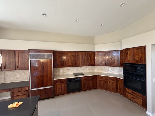 Kitchen with tile backsplash and plank floor